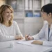 Korean medical coordinator consulting with a foreign patient in a clinic, personalized healthcare assistance in Korea